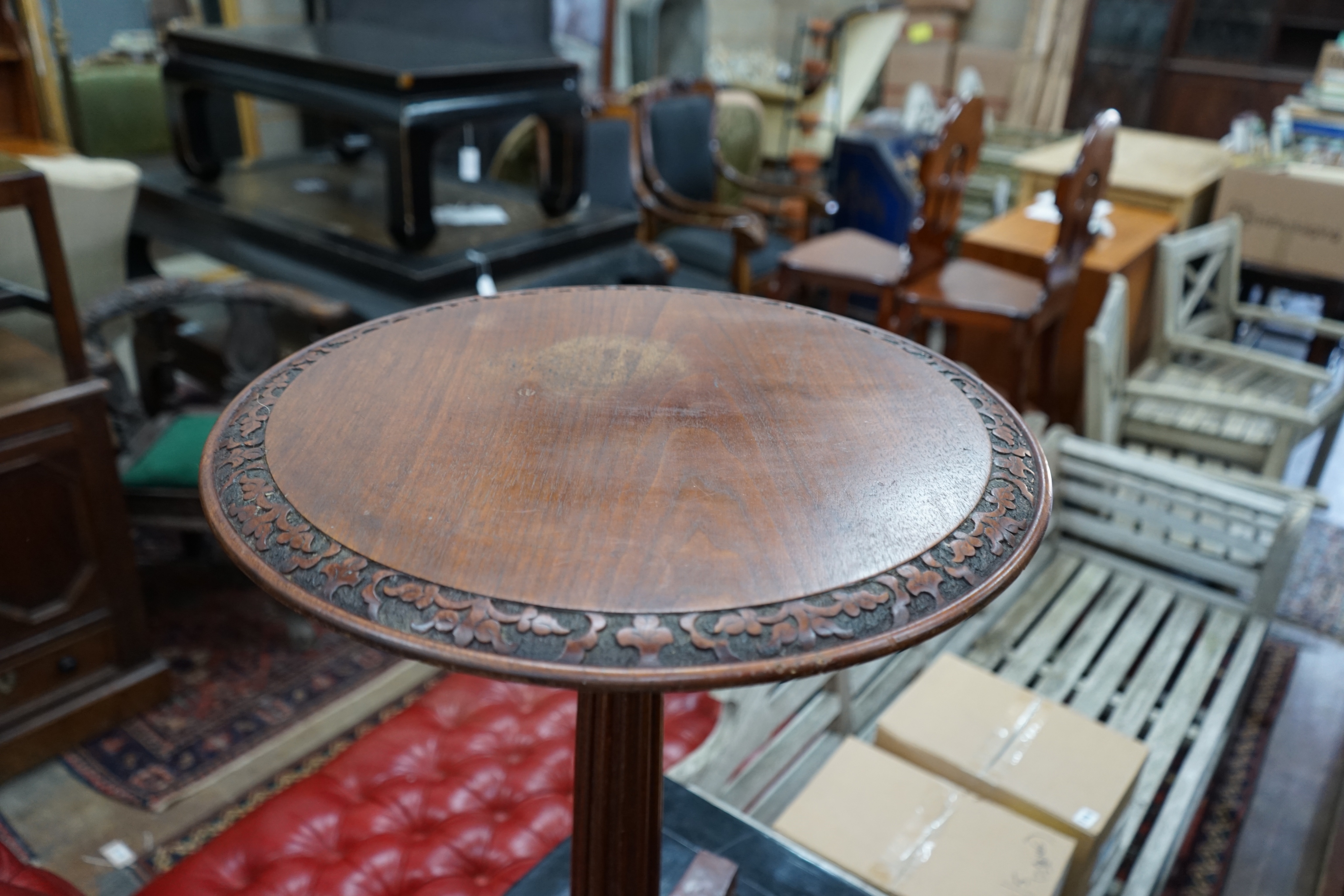 A Gillows style circular mahogany wine table, diameter 50cm height 71cm